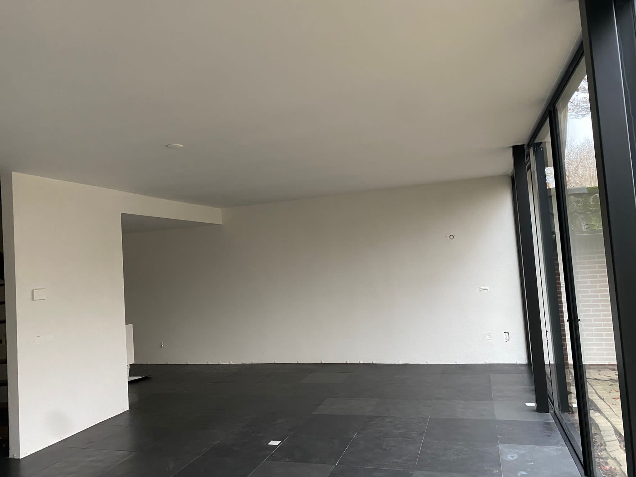 Gespoten woning huissen